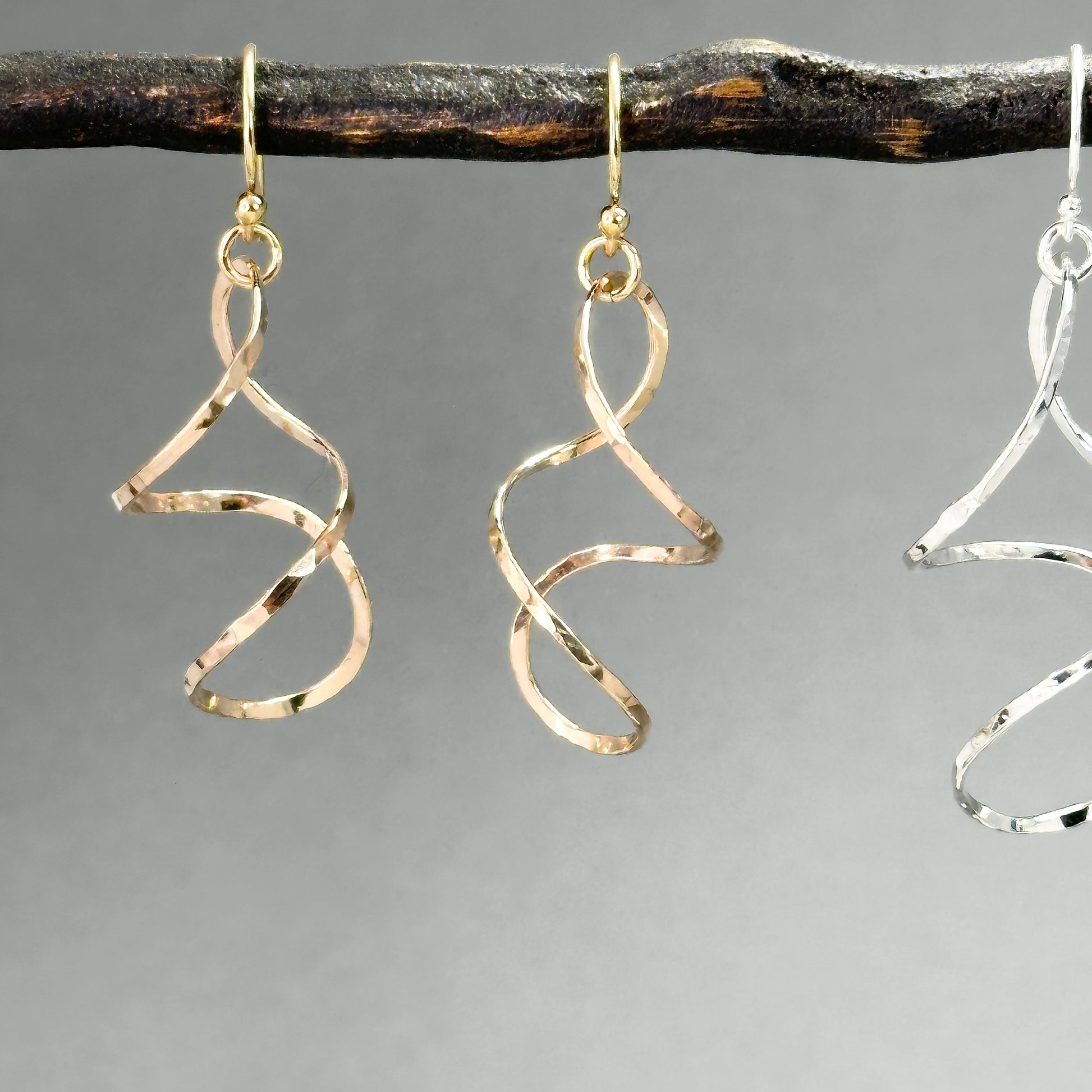 twisty dangle earrings in sterling silver or 14kt gold filled in four sizes from 1.25 inches up to two inches long, very lightweight with lots of movement. Handmade silver and gold jewelry made by Hanni jewelry, harbor springs, Michigan.