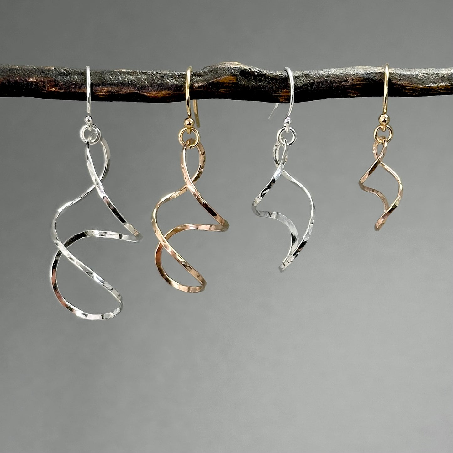 twisty dangle earrings in sterling silver or 14kt gold filled in four sizes from 1.25 inches up to two inches long, very lightweight with lots of movement. Handmade silver and gold jewelry made by Hanni jewelry, harbor springs, Michigan.