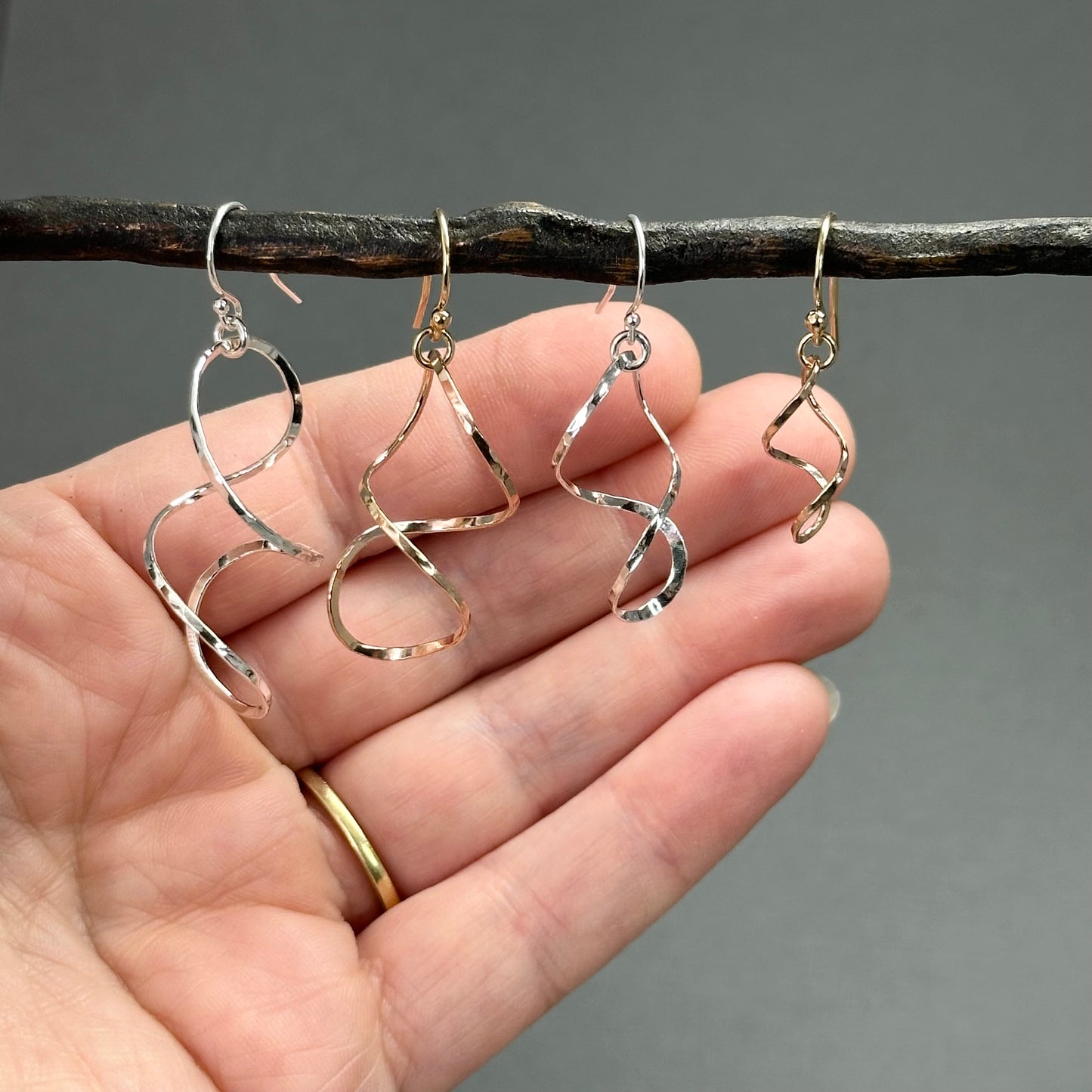 twisty dangle earrings in sterling silver or 14kt gold filled in four sizes from 1.25 inches up to two inches long, very lightweight with lots of movement. Handmade silver and gold jewelry made by Hanni jewelry, harbor springs, Michigan.