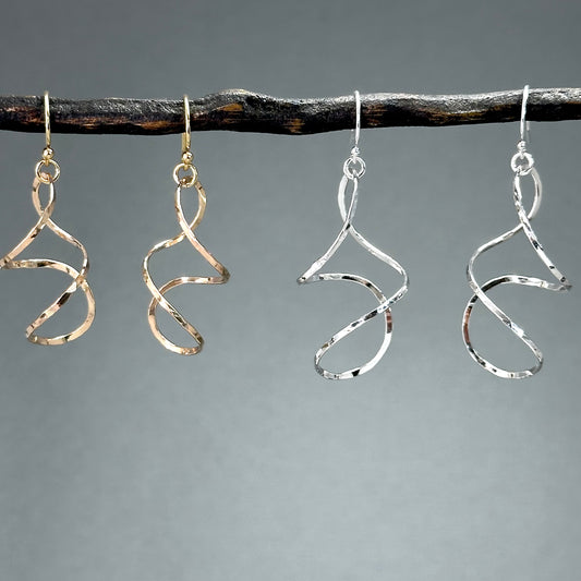 twisty dangle earrings in sterling silver or 14kt gold filled in four sizes from 1.25 inches up to two inches long, very lightweight with lots of movement. Handmade silver and gold jewelry made by Hanni jewelry, harbor springs, Michigan.