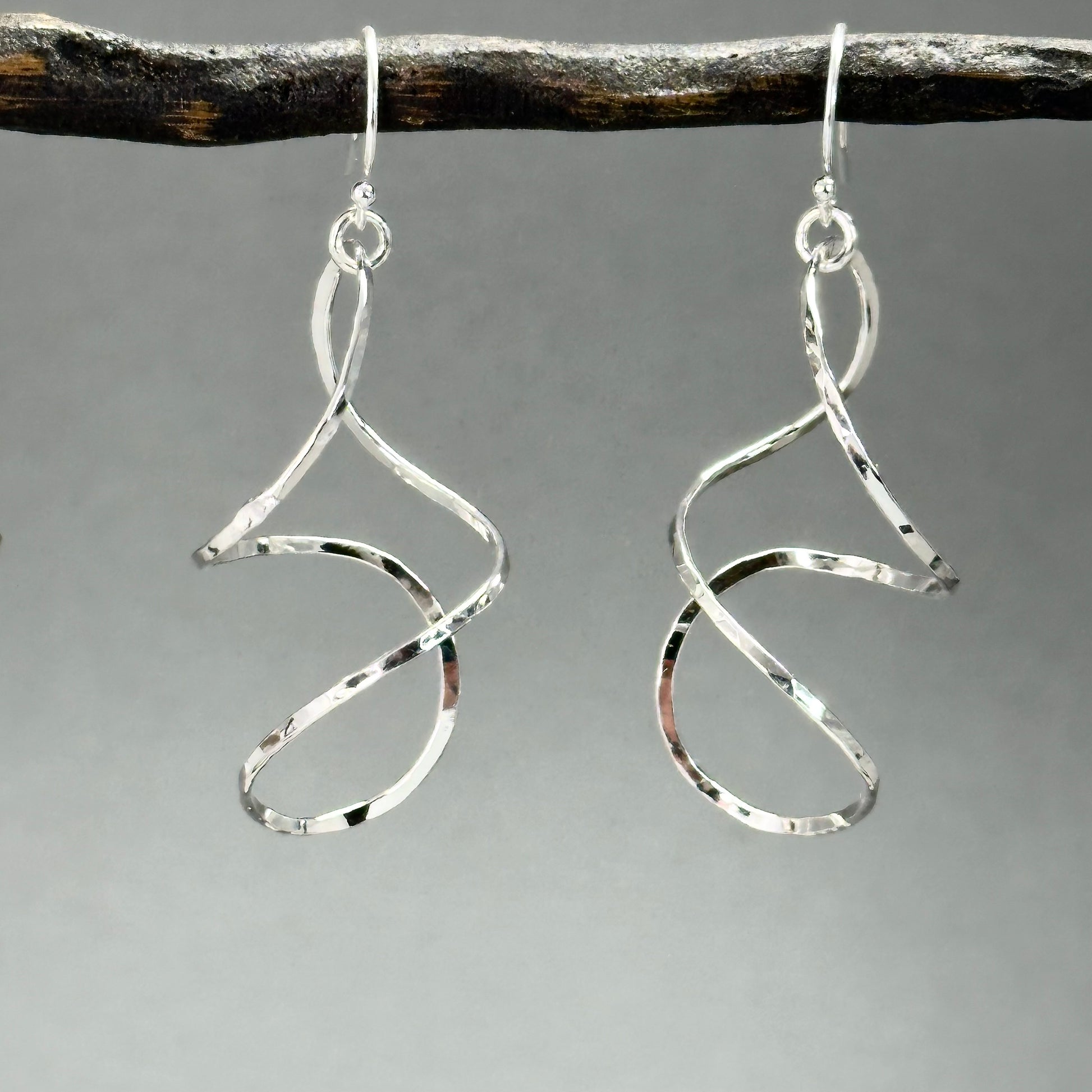 twisty dangle earrings in sterling silver or 14kt gold filled in four sizes from 1.25 inches up to two inches long, very lightweight with lots of movement. Handmade silver and gold jewelry made by Hanni jewelry, harbor springs, Michigan.