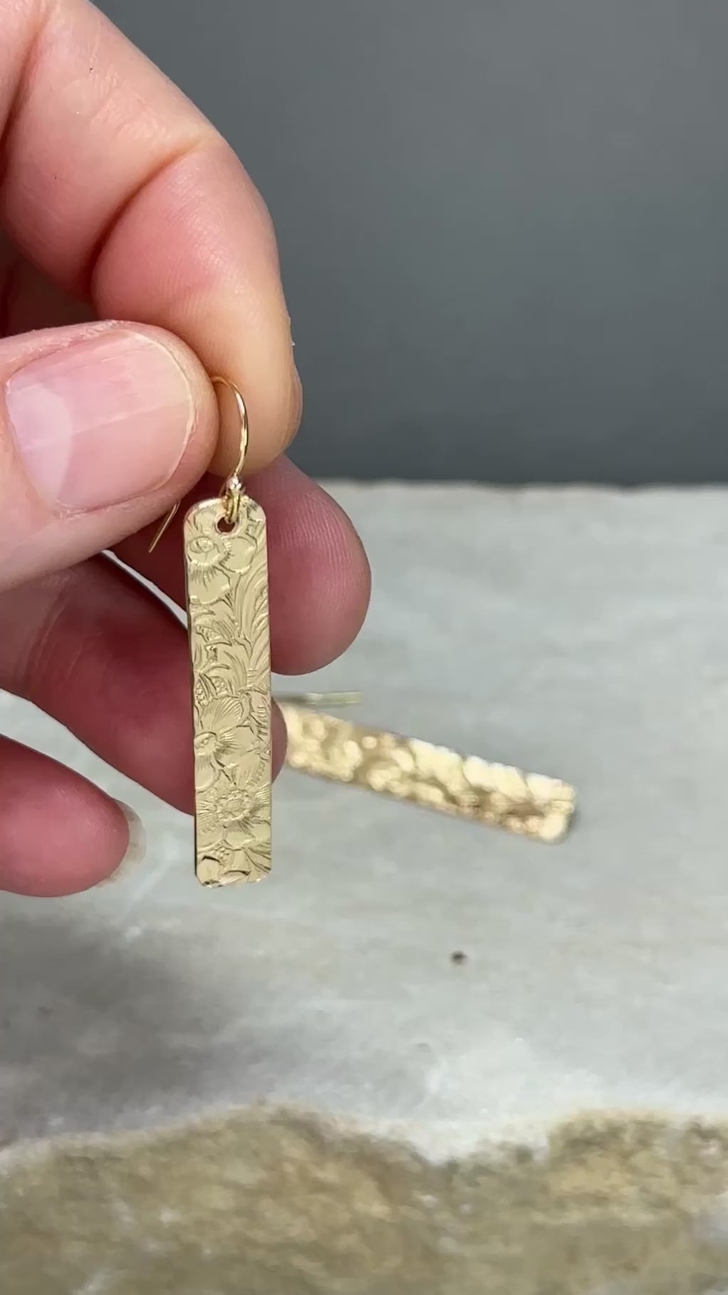 14kt gold filled or sterling bar dangle earrings with a 1/4 inch wide x 1.5 inch long bar with an embossed vintage floral pattern, hangs from standard ear wires or lever back hooks. hand crafted artisan jewelry by hanni jewelry, harbor springs, michigan.