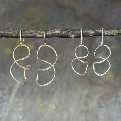 Twisty wire earring for dressing up or down in sterling silver or 14kt gold filled in four sizes 1 to 2 inches long, available on french hook or leverback ear wires, simple classic handmade by hanni jewelry in harbor springs, michigan