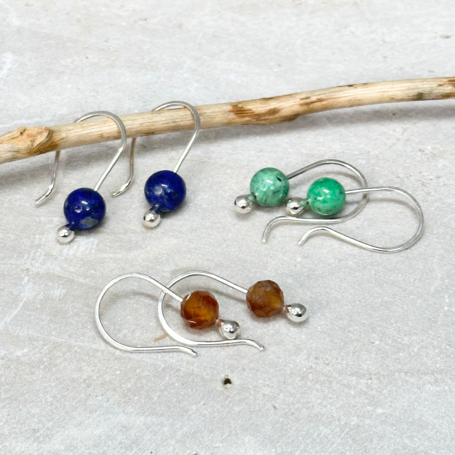 Simple small gemstone earring sterling silver hook ear wire with silver drop holding on stone, comes in apatite, lapis, moonstone, variscite, garnet, onyx and more. 6mm stones. Handmade jewelry by Hanni Jewelry, Harbor Springs, Michigan.