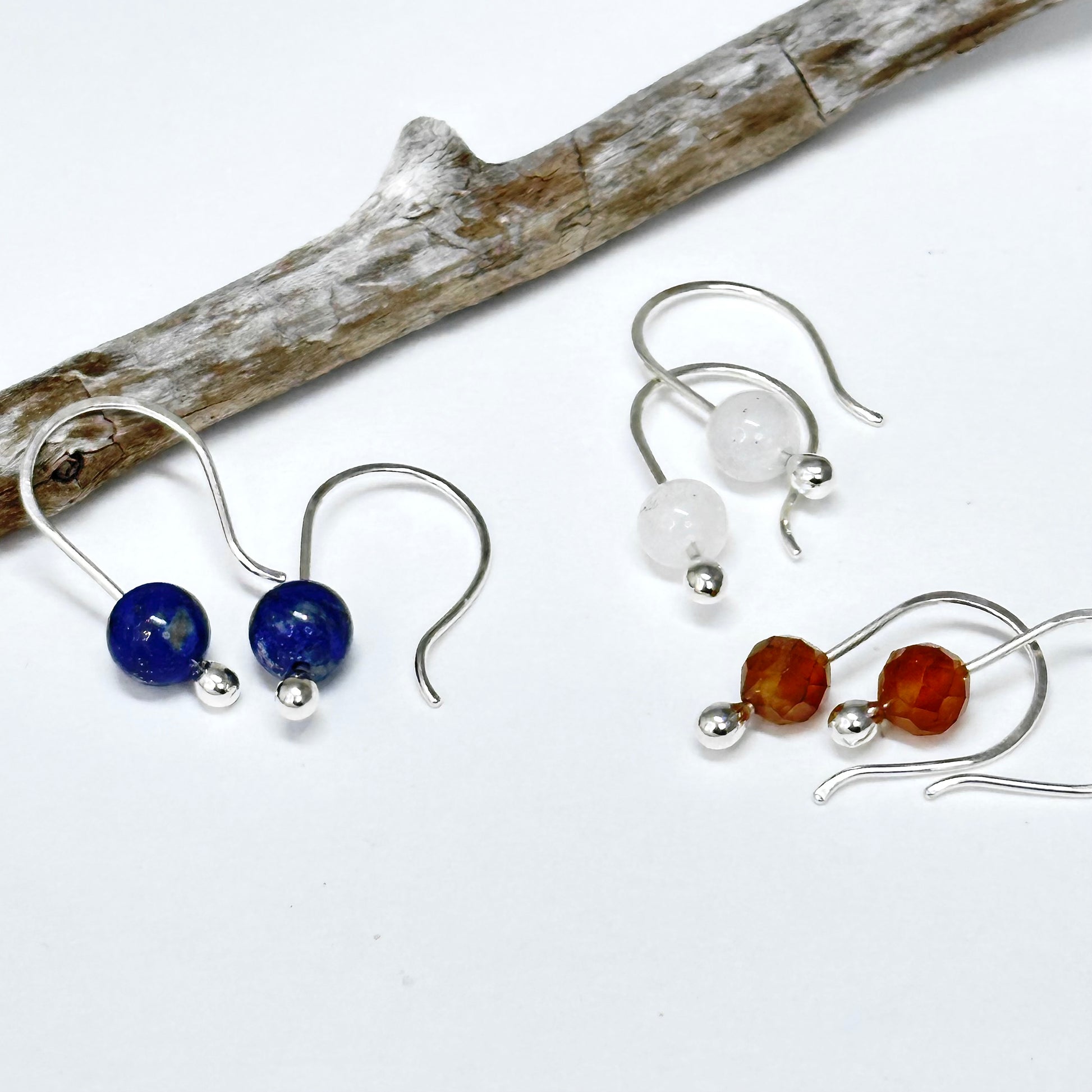 Simple small gemstone earring sterling silver hook ear wire with silver drop holding on stone, comes in apatite, lapis, moonstone, variscite, garnet, onyx and more. 6mm stones. Handmade jewelry by Hanni Jewelry, Harbor Springs, Michigan.