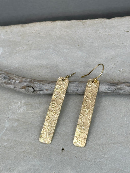 14kt gold filled or sterling bar dangle earrings with a 1/4 inch wide x 1.5 inch long bar with an embossed vintage floral pattern, hangs from standard ear wires or lever back hooks. hand crafted artisan jewelry by hanni jewelry, harbor springs, michigan.