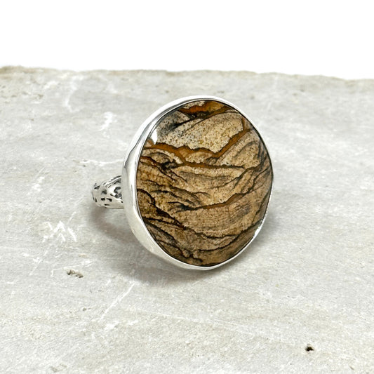 picture jasper statement ring sterling argentium and fine silver with carved branch ring band. stone is 1.25 inched in diameter. scenic jasper jewelry handmade sterling silver by Hanni jewelry, harbor springs, Michigan pure Michigan jewelry